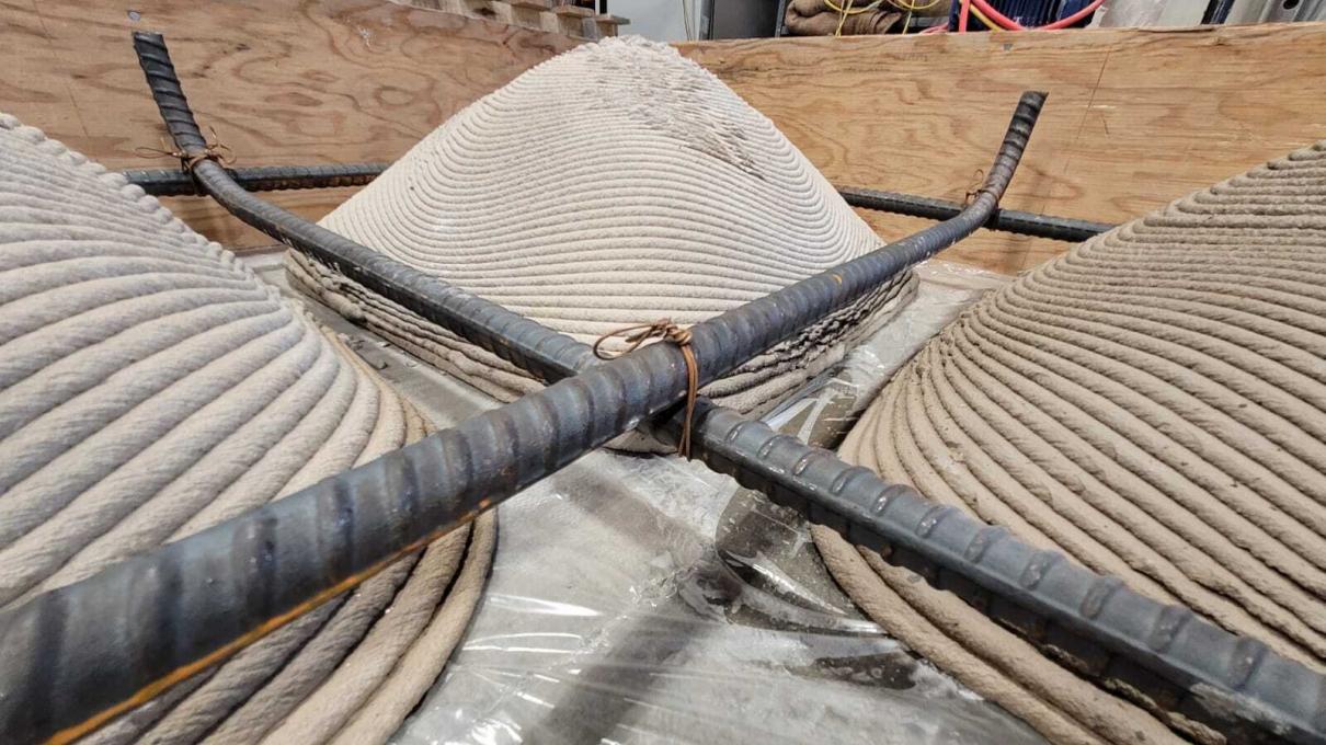 Structurally optimized floor slab uses 3D printed squinch vault formwork to substantially reduce material consumption through precision geometry.  With Ashley Hartwell, Alexander Curth, and Caitlin Mueller of MIT and Tim Brodesser of Twente Additive Manufacturing.  Photo by Jim Ziemlanski.